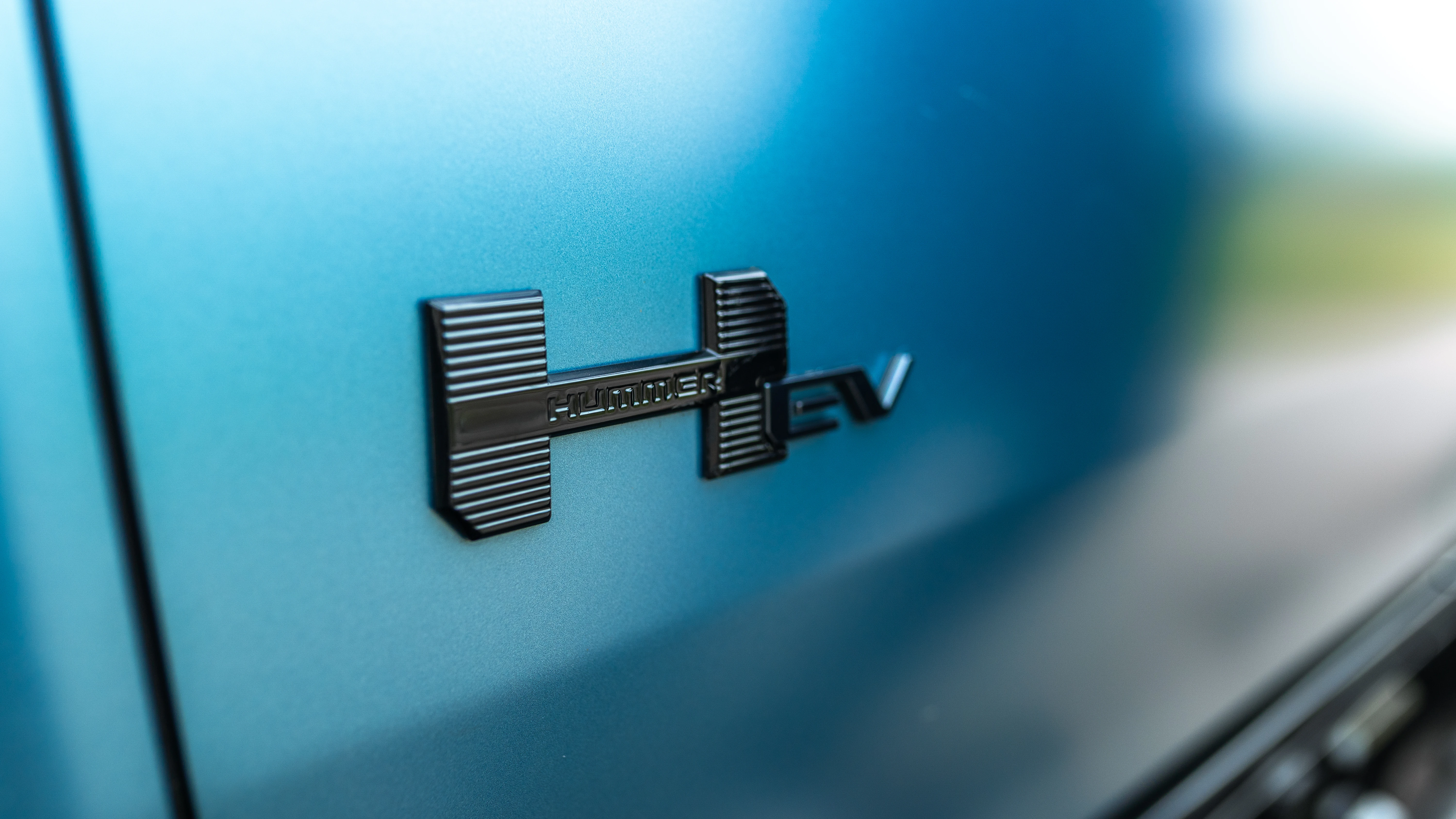 HUMMER EV fender badge in gloss black on Neptune Blue matte paint