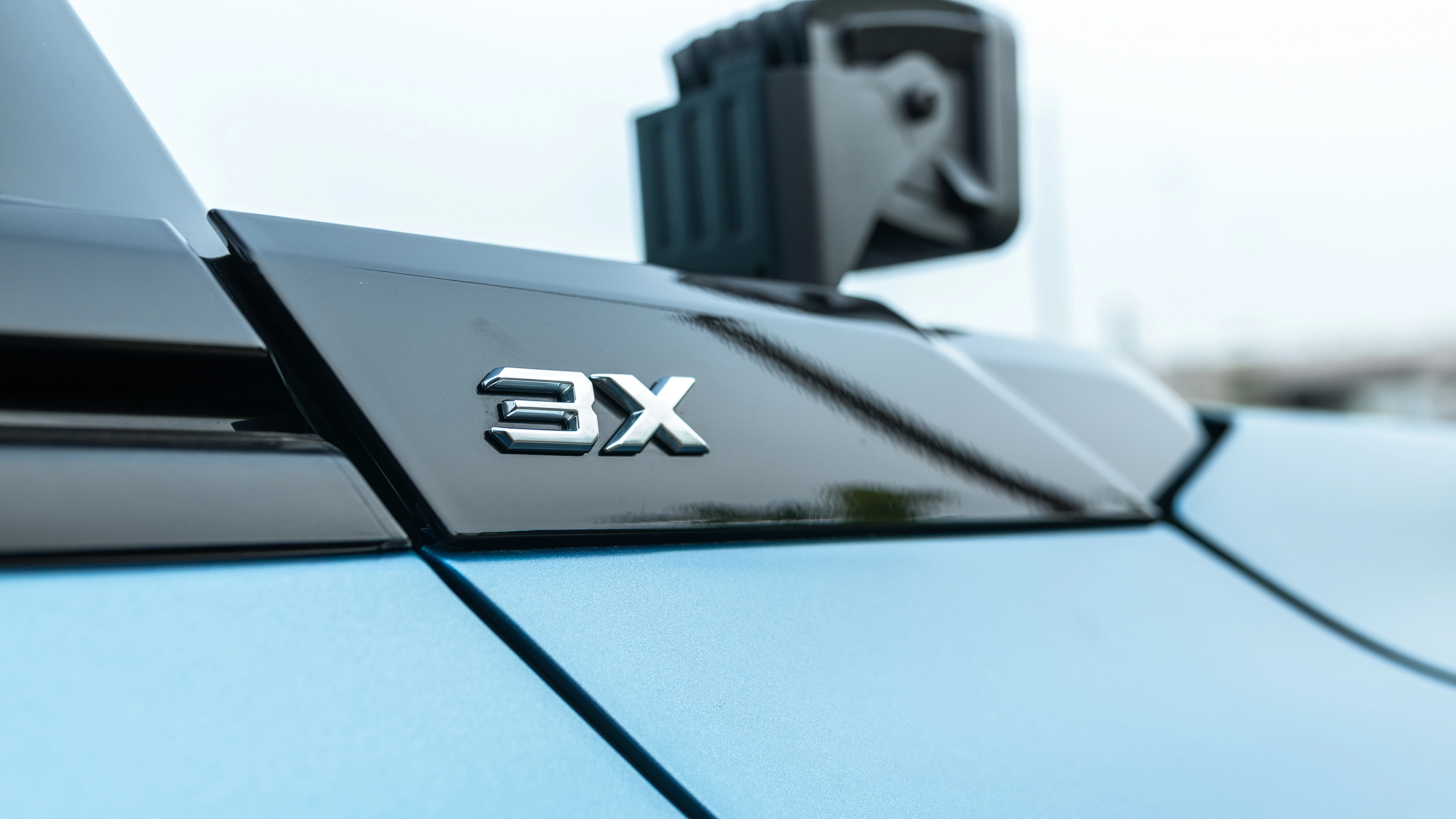 3X badge on the gloss black hood cowl