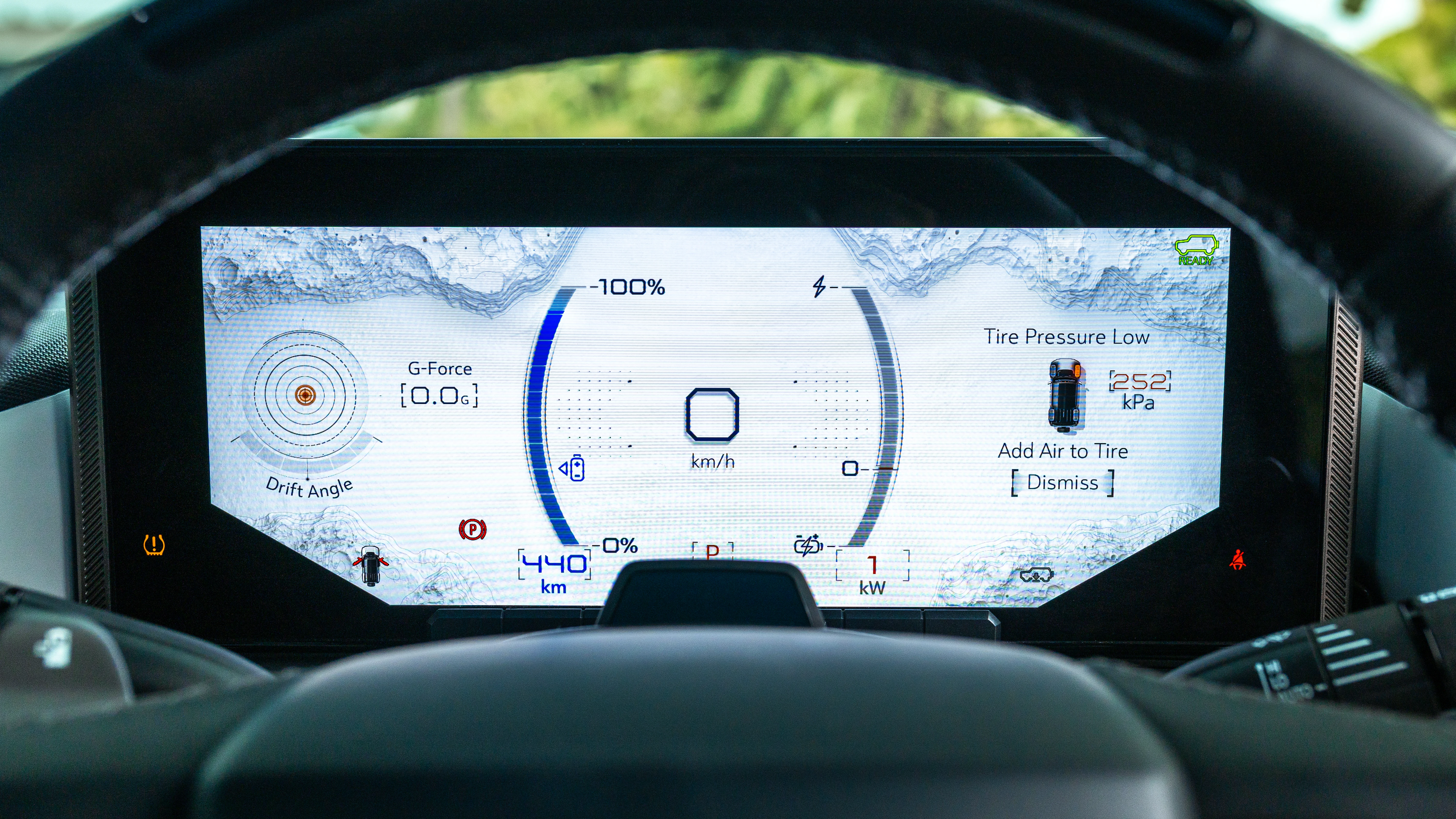 12.3-inch digital instrument cluster showing battery state and lunar graphics