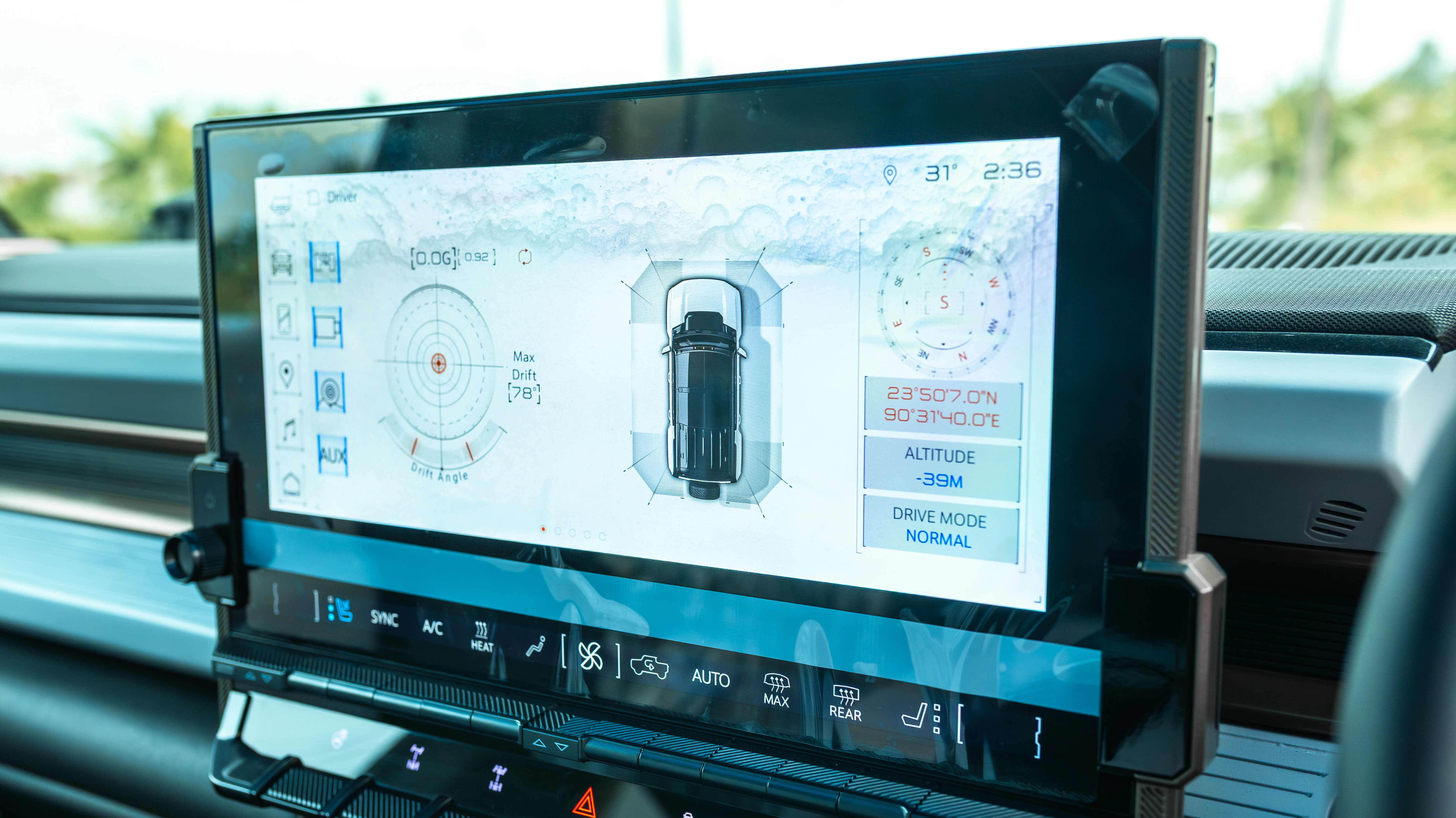 13.4-inch infotainment display showing off-road telemetry, compass and drive mode