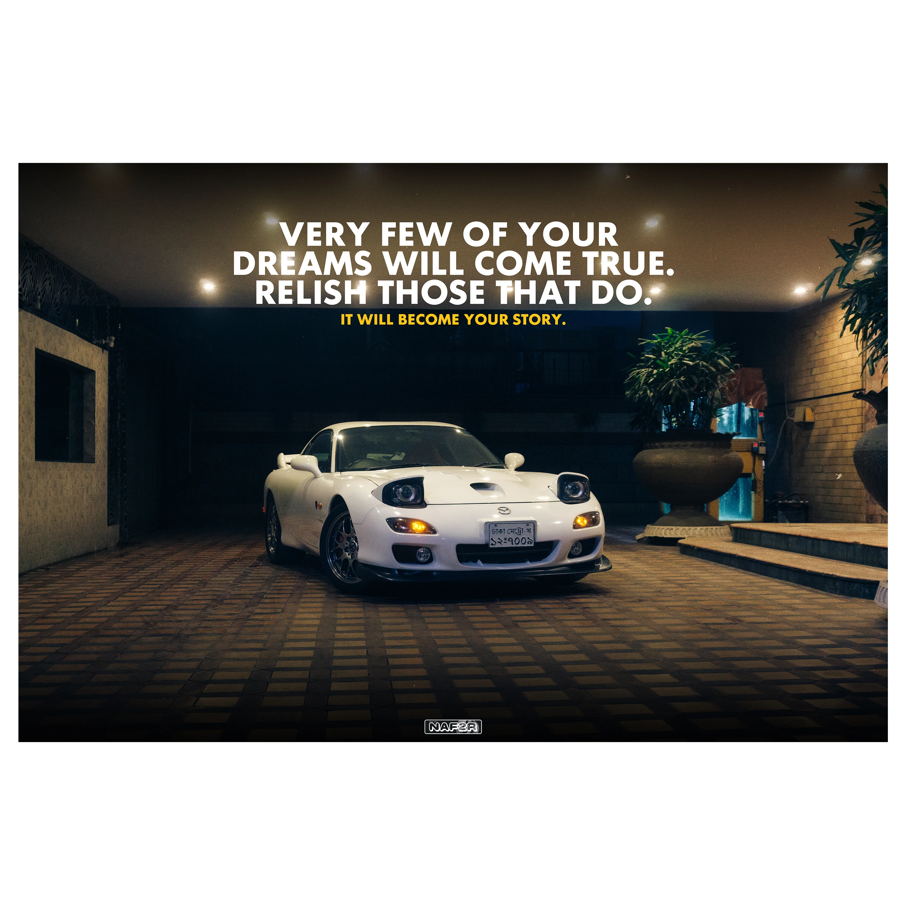 RX-7 Spirit R in a lit garage at night